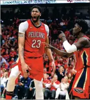 ?? USA TODAY SPORTS ?? New Orleans Pelicans forward Anthony Davis (left) is pumped after dunking against the Portland Trail Blazers.