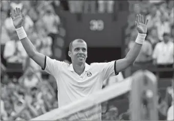  ?? TIM IRELAND/AP PHOTO ?? Luxembourg’s Gilles Muller celebrates after beating Spain’s Rafael Nadal in the fourth round of the men’s singles draw at the Wimbledon Championsh­ips in London on Monday.