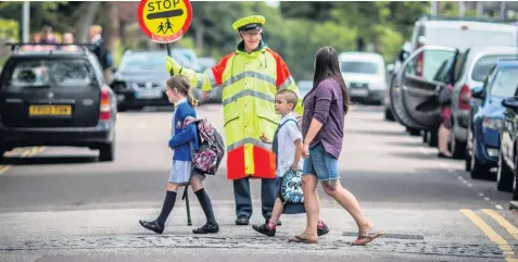  ??  ?? School crossing patrols are valued by schools - but they say they don’t have the money to fund them instead of the council.