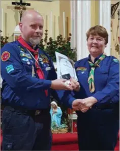  ??  ?? Pam Luckie (right) with County Commission­er Dermot Moore at a presentati­on in St Mochonog’s Church.