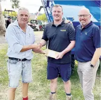  ?? ?? Lardner Park immediate past chairman Duncan McNeil (left) and chief executive officer Craig Debnam (right) with 2023 Farm World tractor driving competitio­n dealer’s award third place getter Ryan King of Tracmac Farm Equipment. This year’s competitio­n is sure to be another tight contest.