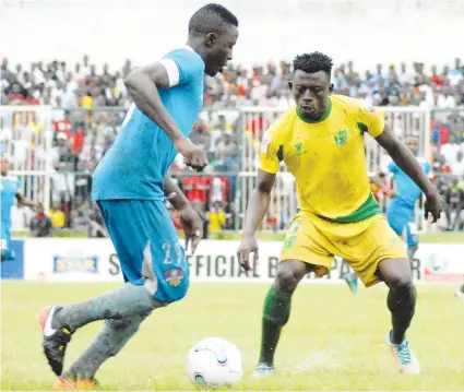  ??  ?? Plateau United FC striker Daniel Itodo (right) and Adebayo Waheed of MFM FC (left) contest for the ball during last season's Nigeria Profession­al Football League