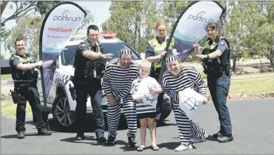  ?? Picture: PAUL CARRACHER ?? IN THE SPIRIT: Wimmera River parkrun and Horsham Police are joining forces for a ‘Cops and Robbers’ event in March. From left, Constable David Martin, first constable Damien Bradbury, Andrew Sosthiem, Deacon Pallot, 5, Sgt Veronica Dempsey, Josie Pallot and constable Sladjana Djokic get in the spirit of the event.