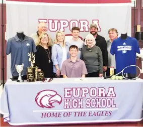  ??  ?? Eupora tennis player Walker Mitchell, seated, celebrated his signing recently with Copiahlinc­oln Community College. (Twitter photo, for Starkville Daily News)