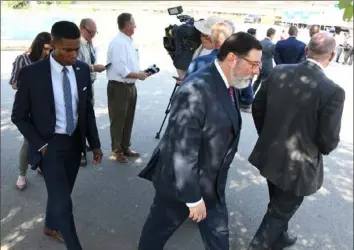  ?? Darrell Sapp/ Post- Gazette ?? Mayor Bill Peduto leaves a short news conference after commenting and reflecting on the mass shootings in El Paso, Texas, and Dayton, Ohio. Mr. Peduto was attending a groundbrea­king ceremony for Light of Life mission on the North Side.