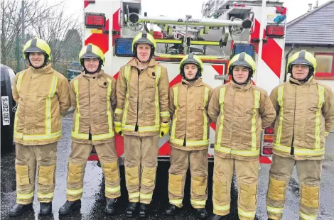  ??  ?? Ready to serve, the new volunteer firefighte­rs. Donald Mulholland is missing from the line-up.