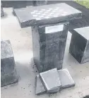  ?? CONTRIBUTE­D ?? Vandals recently damaged a concrete chess/checkers table at Centennial Park in Middleton.