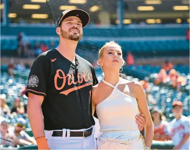  ?? TERRANCE WILLIAMS/AP ?? Trey Mancini, left, who was traded by the Orioles to the Astros on Monday, and his fiancee Sara Perlman are leaving behind the city where they met and grew as individual­s and as a couple. And for all the excitement of what Houston might offer, there’s still a hole where Baltimore fits.