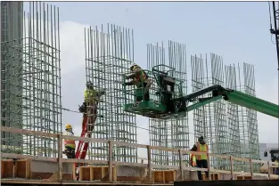  ?? CARLOS OSORIO — THE ASSOCIATED PRESS FILE ?? In this April 16, 2020, file photo work continues on a bridge on the Interstate Highway 75 project in Troy, Mich.