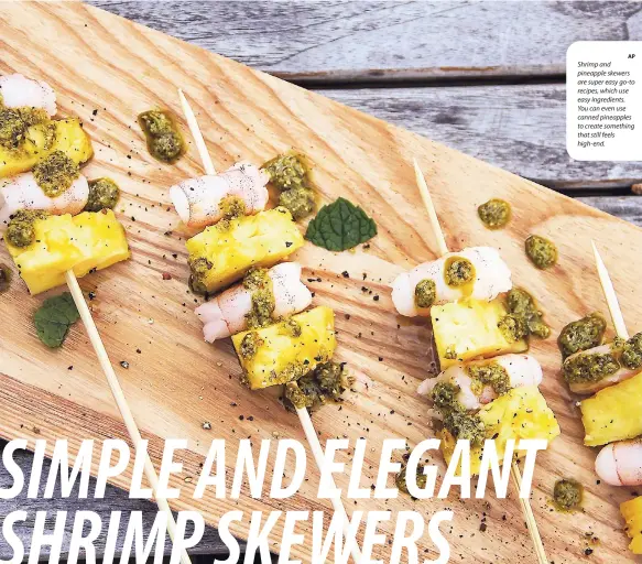  ?? AP ?? Shrimp and pineapple skewers are super easy go-to recipes, which use easy ingredient­s. You can even use canned pineapples to create something that still feels high-end.