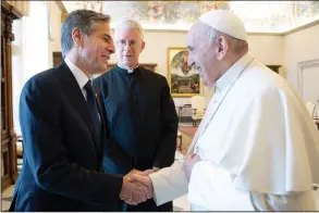 ?? (AP/Vatican Media) ?? Secretary of State Antony Blinken (left) shakes hands with Pope Francis on Monday as they meet at the Vatican.