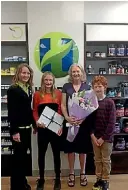  ??  ?? Jade from the Kerikeri Hardy’s health store presents Cleo, Cheryl and Oliver
Body with their prize. They are the winners of a national Weekend Getaway to Queenstown Competitio­n hosted by Hardy’s and Ethical Nutrients.