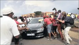  ??  ?? FINE: EFF members try to stop the car of former deputy higher education minister Mduduzi Manana at the Randburg Magistrate’s Court yesterday.