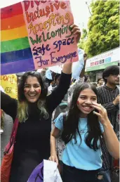  ?? — PTI ?? Students hold placards during a Queer Pride march from Motilal Nehru College to Venkateswa­ra College in South Delhi on Monday.