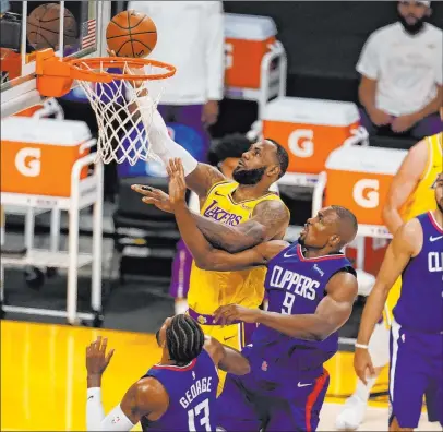  ?? Marcio Jose Sanchez The Associated Press ?? Lebron James and the Lakers will take on the Dallas Mavericks on Christmas Day, and the Clippers will face the Denver Nuggets.