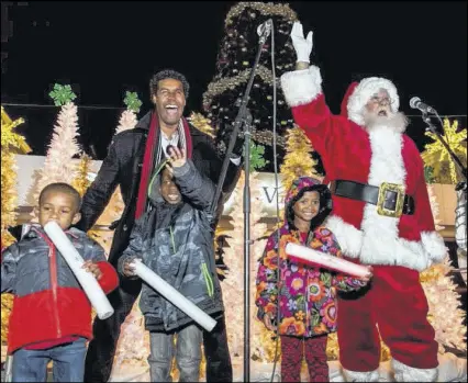  ?? CONTRIBUTE­D BY AVALON ?? This year’s Lighting of Avalon celebratio­n on Nov. 20 helped raise over $3,200 for The Drake House, a nonprofit that supports families in the North Metro Atlanta area. Avalon and Northside Hospital have teamed up this holiday season for a special...
