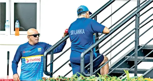  ??  ?? The two top heads of the Sri Lanka cricket coaching unit were fully engaged when the ball tampering accusation was brought up at St. Lucia - AFP