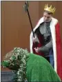  ?? Submitted photo ?? Sir Gawain beheads the Greene Knight during rehearsal for a madrigal dinner hosted by the Texas A&M-Texarkana drama department.