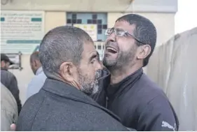  ?? ?? A Palestinia­n man mourns the death of relatives killed in an Israeli bombardmen­t, at the morgue of the European hospital in Khan Yunis in the southern Gaza Strip yesterday. PHOTO: AFP