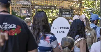  ?? JEFF GRITCHEN — STAFF PHOTOGRAPH­ER ?? Disneyland guests wait to board Indiana Jones Adventure. If the park’s efforts at crowd-size control seem nonexisten­t, consider how bad some evenings were before reservatio­ns and the revamped pass system were instituted.