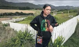  ?? Picture / Alan Gibson ?? Vicki Harlick, here at the urupa (graveyard) where her sister Marie is buried in Waihau Bay, East Coast, feels full of guilt.