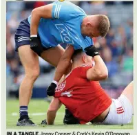  ?? ?? IN A TANGLE Jonny Cooper & Cork’s Kevin O’Donovan