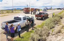  ?? JOHN MILLER/THE TAOS NEWS ?? A CareFlight helicopter touched down on the west side of the Rio Grande Gorge Bridge on Saturday afternoon to airlift a 74-yearold man who was struck by a driver in a silver-colored sedan.