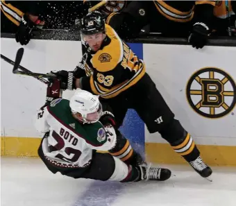  ?? STuART CAHILL pHOTOs / HeRALd sTAFF FILe ?? OFFICIALLY ANGRY: Brad Marchand, seen here delivering a hit to Arizona’s Travis Boyd on March 12, has taken issue with his recent treatment by referees.