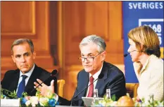  ?? Bloomberg ?? Jerome Powell, center, chairman of the U.S. Federal Reserve, speaks at a conference to celebrate the 350th anniversar­y of the Riksbank in Stockholm, Sweden, on Friday.