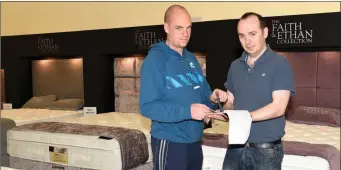  ??  ?? Denis O Donnell showing customer John Lynch a selection of bedding at O Donnell’s Furniture and Flooring, Cork Road, Killarney.