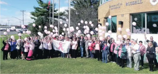  ?? —photo Vicky Charbonnea­u ?? As October was declared Breast Cancer awareness month by Russell Township, last Friday’s ceremony gave the Friends for Life group the opportunit­y to raise the breast cancer flag, as well as to celebrate the survivors, encourage those in battle and...