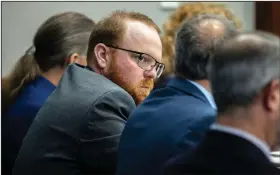  ?? (AP/Stephen B. Morton) ?? Travis McMichael sits with his attorneys Monday before the closing arguments for the trial in Brunswick, Ga.