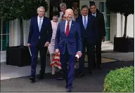  ?? (AP/Evan Vucci) ?? President Joe Biden steps outside the White House with a bipartisan group of senators Thursday to announce their agreement on an infrastruc­ture bill. “They’ve given me their word,” he said of the five Republican­s and five Democrats. “Where I come from, that’s good enough for me.”