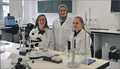  ??  ?? Argyll College’s applied science tutor Sophie Hall (centre) teaches microbiolo­gy to students Lauren Powell (left) and Kirsty Wright (right) in a SAMS laboratory. in Dunstaff nage.