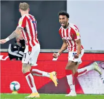 ??  ?? Winning strike: Stoke City’s Jacob Brown (right) celebrates scoring his side’s decisive goal as they beat Wolves in the Carabao Cup