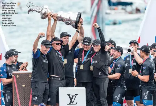  ??  ?? Emirates Team New Zealand skippered by Peter Burling celebrate during the award ceremony at the 35th Louis Vuitton America’s Cup