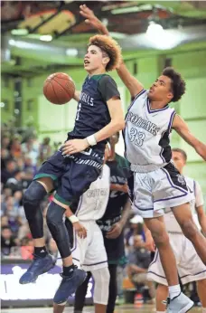  ?? MARK J. REBILAS, USA TODAY SPORTS ?? Sophomore LaMelo Ball, left, scored 27 points in a 105-70 Chino Hills victory at Rancho Cucamonga.