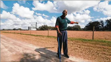  ?? CONTRIBUTE­D ?? Jim “Mudcat” Grant, an outspoken pitcher and broadcaste­r with the Cleveland Indians, stands where he used to play ball as a kid in Lacoochie, Florida. He once punched an Indians pitching coach over a racist comment.