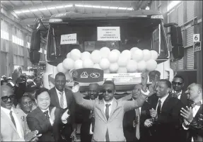  ?? PROVIDED TO CHINA DAILY ?? Executives cheer the first truck assembled by Sinotruk and its African partner N.A. Metal Industry & Engineerin­g Co in Ethiopia in November 2017.