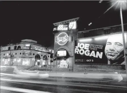  ?? Luis Sinco Los Angeles Times ?? A BILLBOARD at the Laugh Factory in West Hollywood promotes Joe Rogan’s show on Netflix, which has been raising its profile.