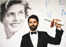  ?? Getty Images ?? Director Ely Dagher wins the Cannes festival’s prestigiou­s Palme d’Or for his animated short film “Waves ’ 98.”
