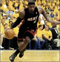  ?? AP/DARRON CUMMINGS ?? LeBron James had 45 points and 15 rebounds in the Miami Heat’s victory over the Boston Celtics on Thursday night to force tonight’s Game 7 of the NBA Eastern Conference final.