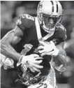  ?? SEAN GARDNER/GETTY ?? Michael Thomas, who caught the go-ahead touchdown, pulls in one of his 11 catches for the Saints.