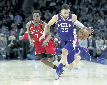  ?? RICH SCHULTZ/THE ASSOCIATED PRESS ?? Philadelph­ia 76ers’ guard Ben Simmons loses the ball, but regains possession as Toronto Raptors’ guard Kyle Lowry defends during the third quarter of an NBA basketball game, in Philadelph­ia, on Monday. The 76ers won 117-111.