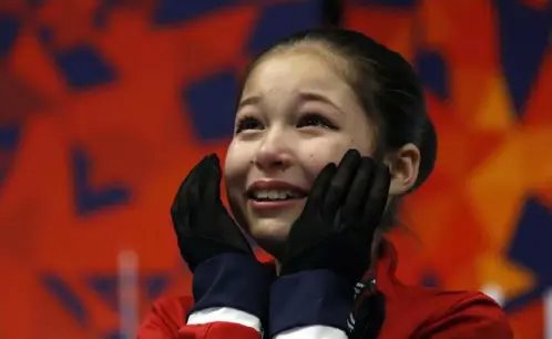  ?? Associated Press ?? Alysa Liu reacts after her score was announced in the women’s free skate at the U.S. Figure Skating Championsh­ips last month in Detroit. Liu won the title. Only 13, she is too young to compete in this weekend’s Four Continents Championsh­ips.