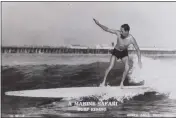  ?? ?? Lee “Scorp” Evans in 1933, riding a finless 14-foot paddle board at Cowell Beach, built with plans from Popular Mechanics magazine.