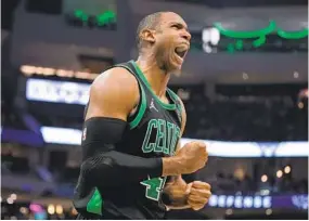  ?? MORRY GASH AP ?? Celtics’ Al Horford reacts after a big play in second half of Game 4 against Bucks.