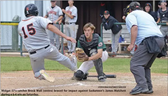  ?? STEVEN MAH/SOUTHWEST BOOSTER ?? Midget 57’s catcher Brock Wall (centre) braced for impact against Saskatoon’s James Matchett during a 6-4 win on Saturday.