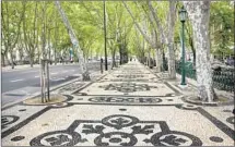  ?? Thomas Roche Getty Images ?? INTRICATE mosaics and black-and-white pavers decorate the wide pedestrian paths along Lisbon’s Avenida da Liberdade.