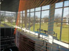  ?? ERIC DEVLIN — DIGITAL FIRST MEDIA ?? Once finished, 600 strands of translucen­t orange monofilame­nt fishing line will cascade diagonally from the ceiling inside the foyer of College Hall at Montgomery County Community College’s Central Campus in Blue Bell. The new art project is designed...